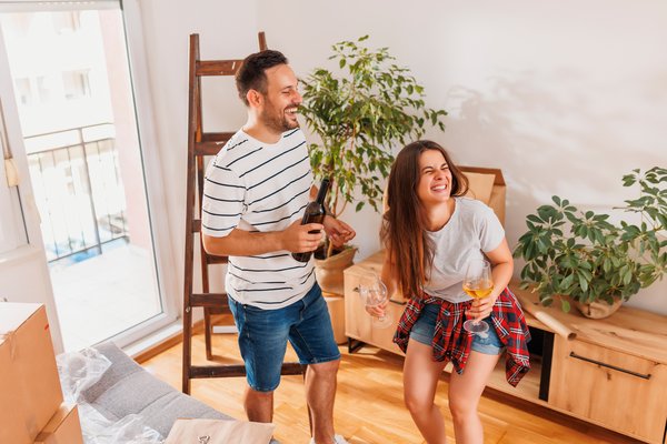 couple-celebrating-moving-in-new-apartment-2026-01-09-00-48-47-utc