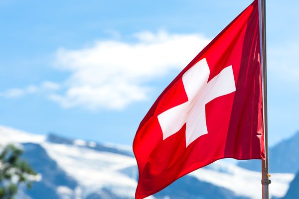 swiss-flag-flying-on-a-mountainous-backdrop-2026-03-25-07-26-05-utc (1)