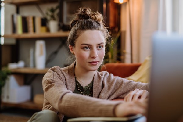 young-woman-with-laptop-resting-in-her-apartment-2026-03-10-03-12-17-utc
